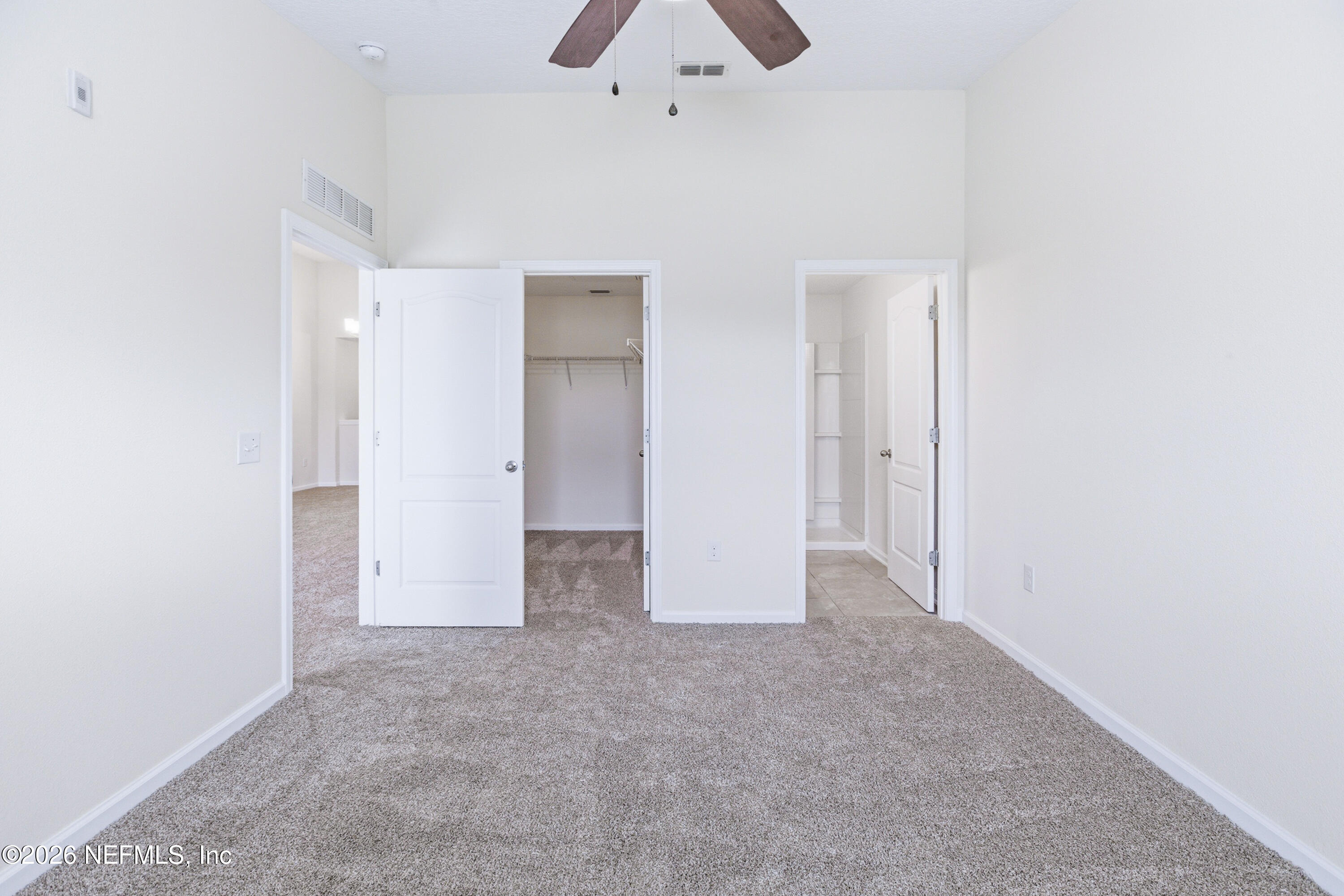 821 Golden Lake Loop St. Augustine, FL 32084 - Photo 11 of 27 an empty room with a bathroom