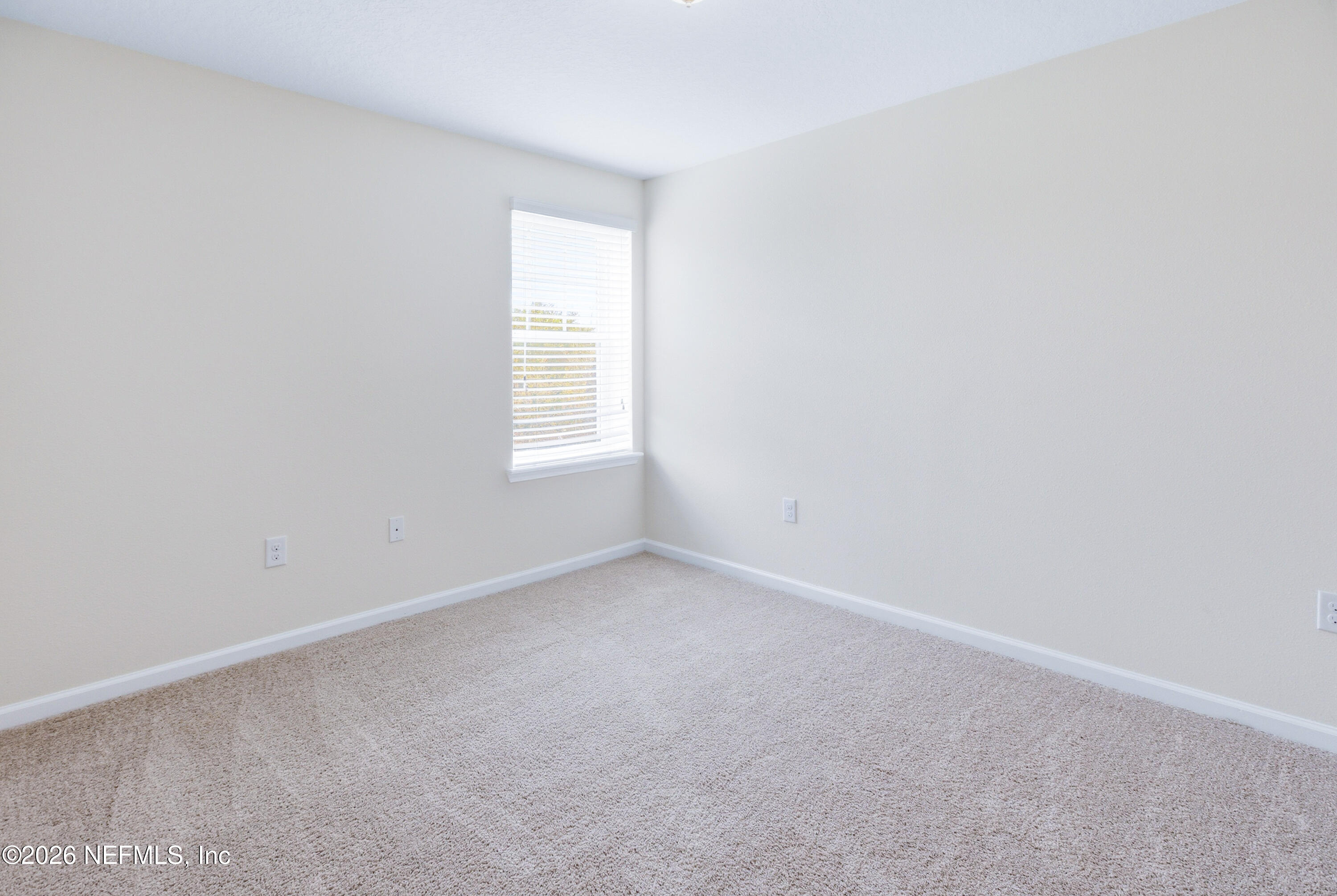 821 Golden Lake Loop St. Augustine, FL 32084 - Photo 13 of 27 an empty room with a window