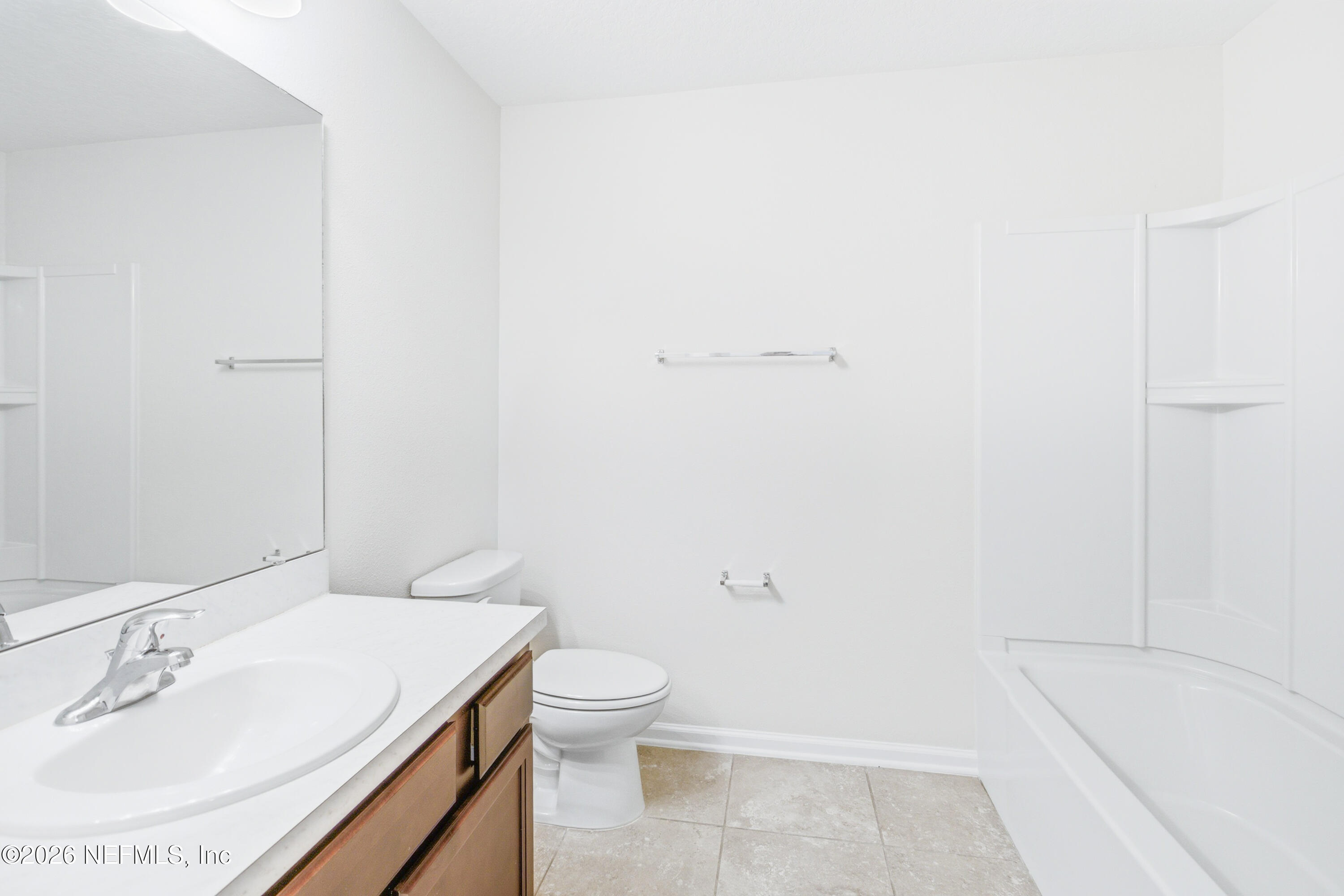 821 Golden Lake Loop St. Augustine, FL 32084 - Photo 14 of 27 a bathroom with a sink a toilet and shower