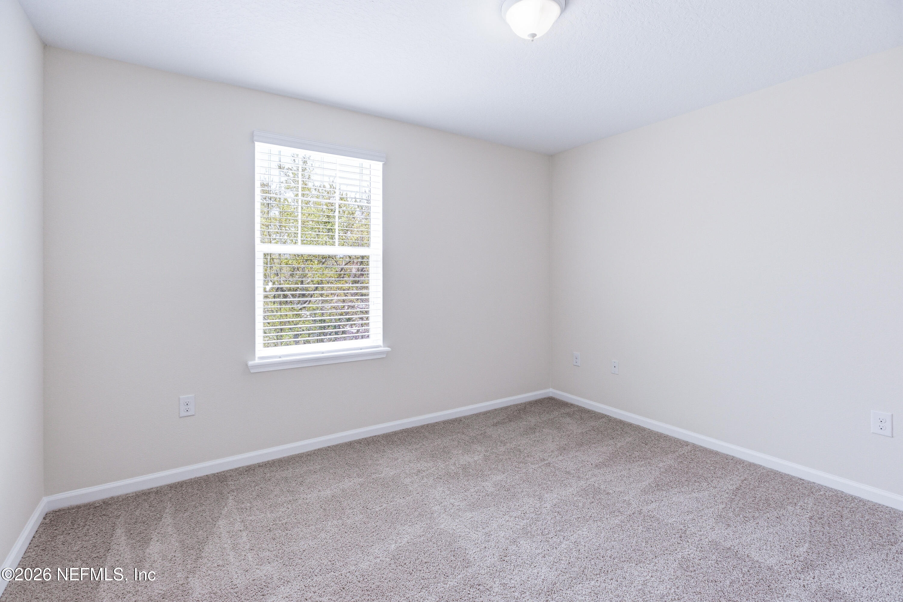 821 Golden Lake Loop St. Augustine, FL 32084 - Photo 15 of 27 an empty room with a window