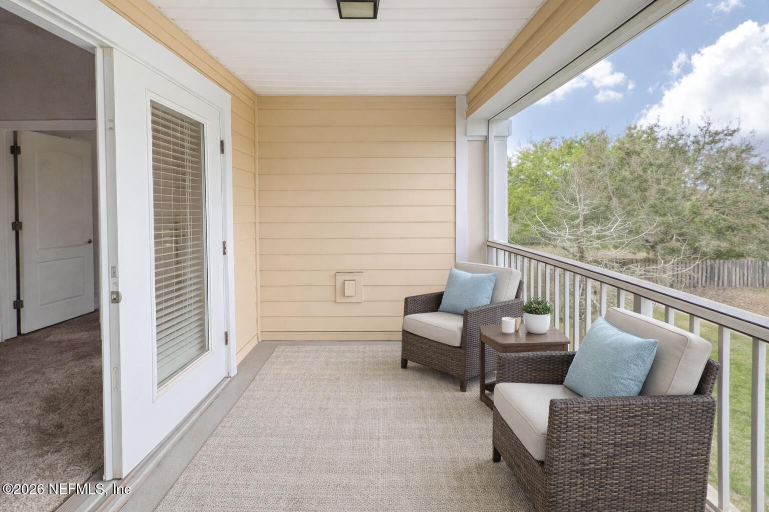 821 Golden Lake Loop St. Augustine, FL 32084 - Photo 17 of 27 a living room with furniture and a large window