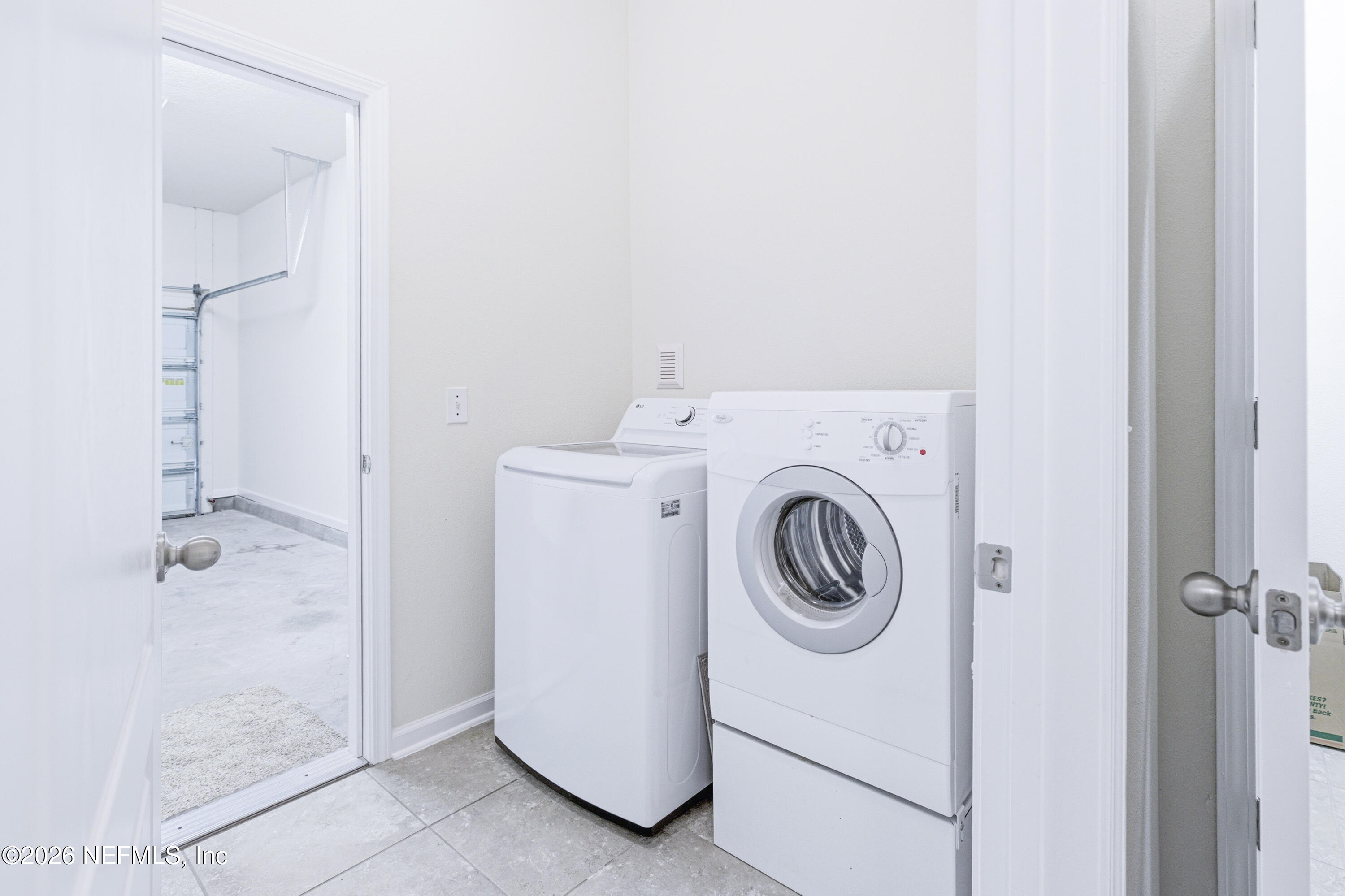 821 Golden Lake Loop St. Augustine, FL 32084 - Photo 18 of 27 a utility room with dryer and washer