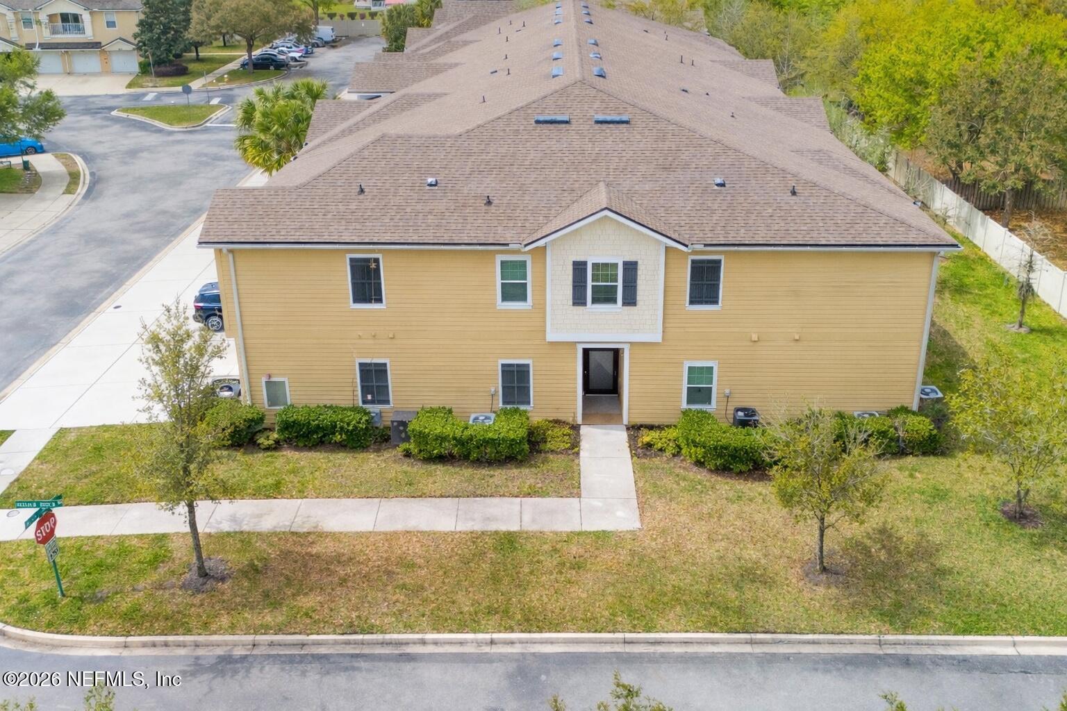 821 Golden Lake Loop St. Augustine, FL 32084 - Photo 20 of 27 a front view of a house with a yard