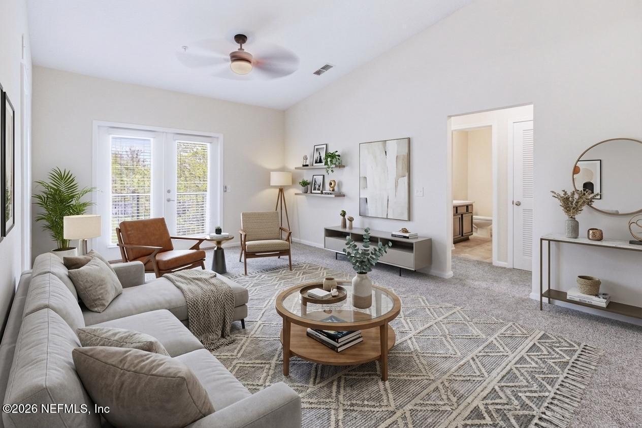 821 Golden Lake Loop St. Augustine, FL 32084 - Photo 3 of 27 a living room with furniture and wooden floor