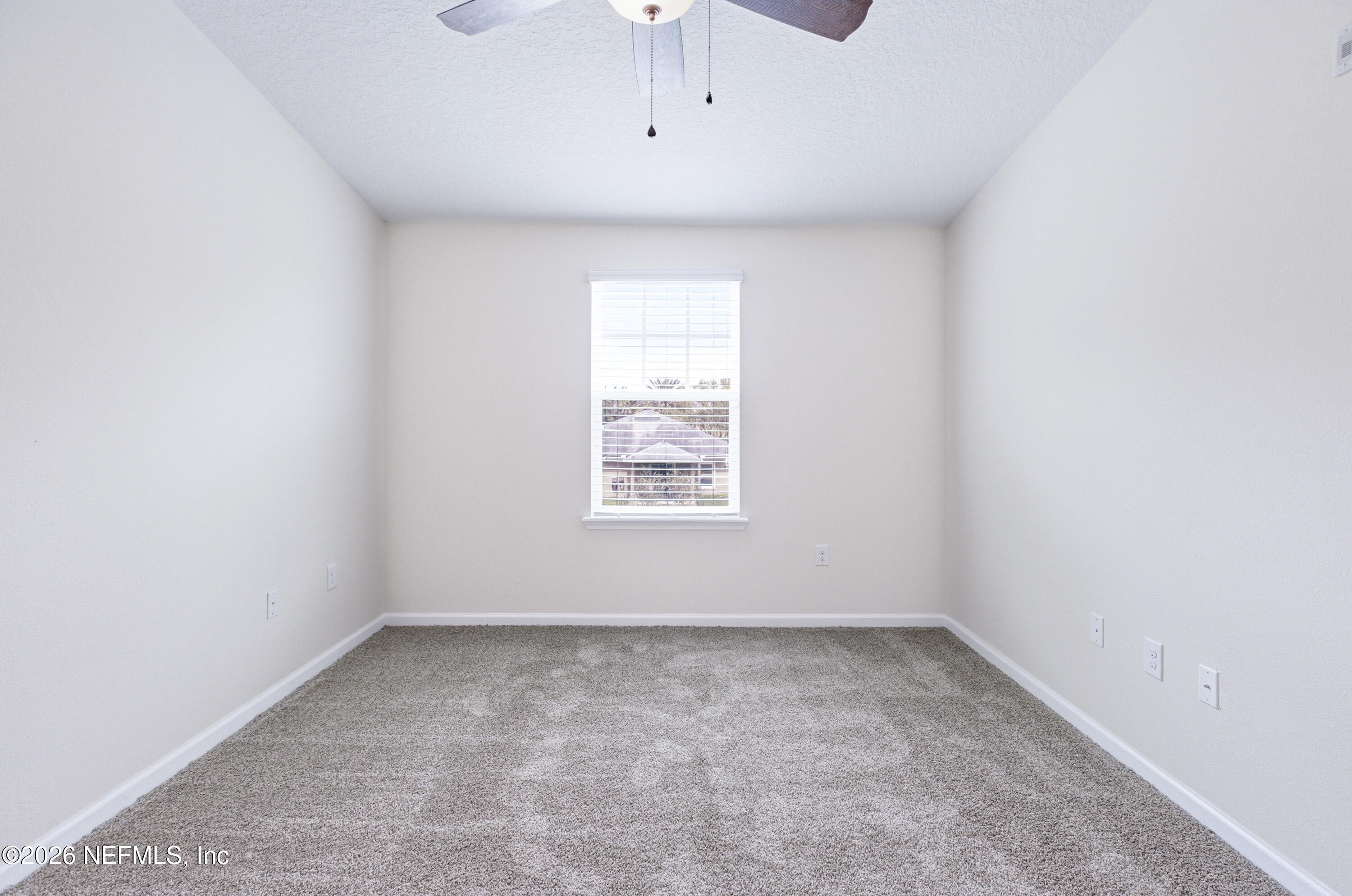 821 Golden Lake Loop St. Augustine, FL 32084 - Photo 9 of 27 an empty room with a window