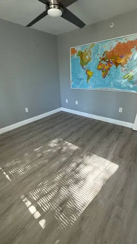 a room with a bed and a dresser