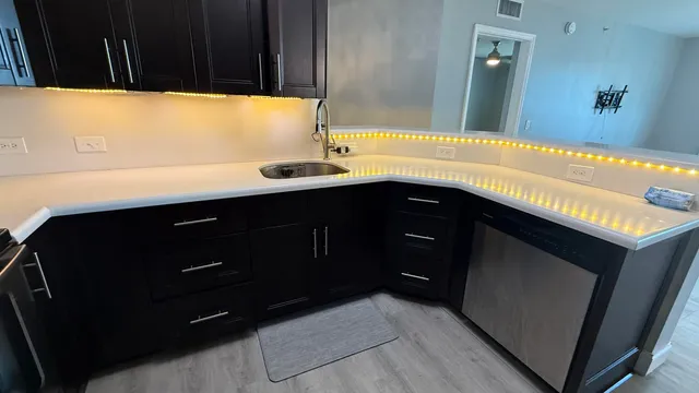 a kitchen with a sink and cabinets