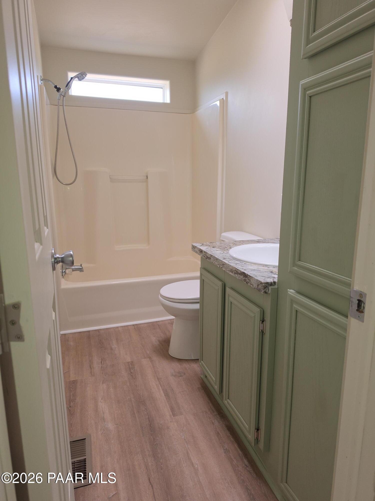 23525 North Ropers Lane Paulden, AZ 86334 - Photo 11 of 25 a bathroom with a granite countertop sink toilet and shower