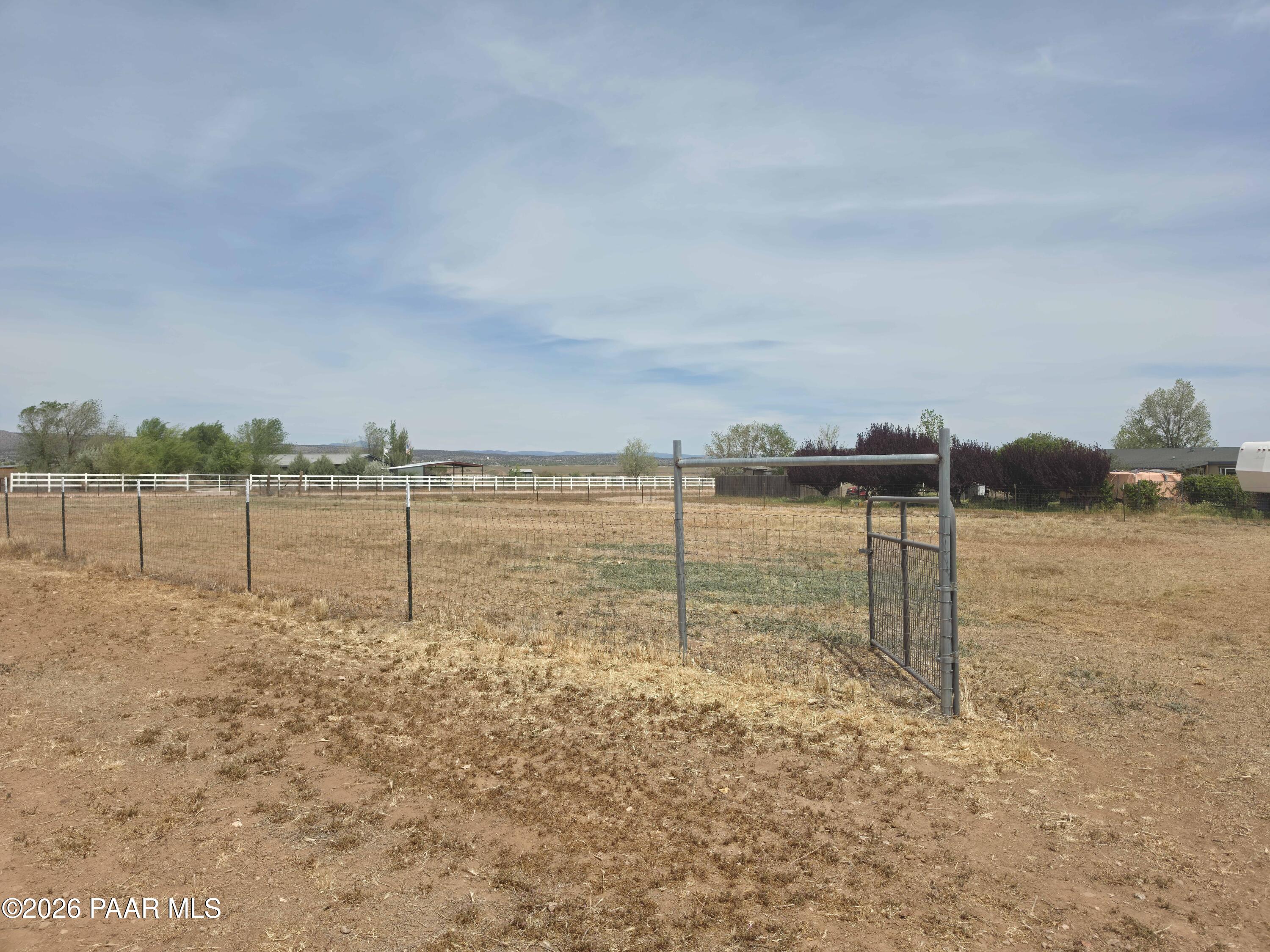 23525 North Ropers Lane Paulden, AZ 86334 - Photo 21 of 25 a view of a yard with an empty space