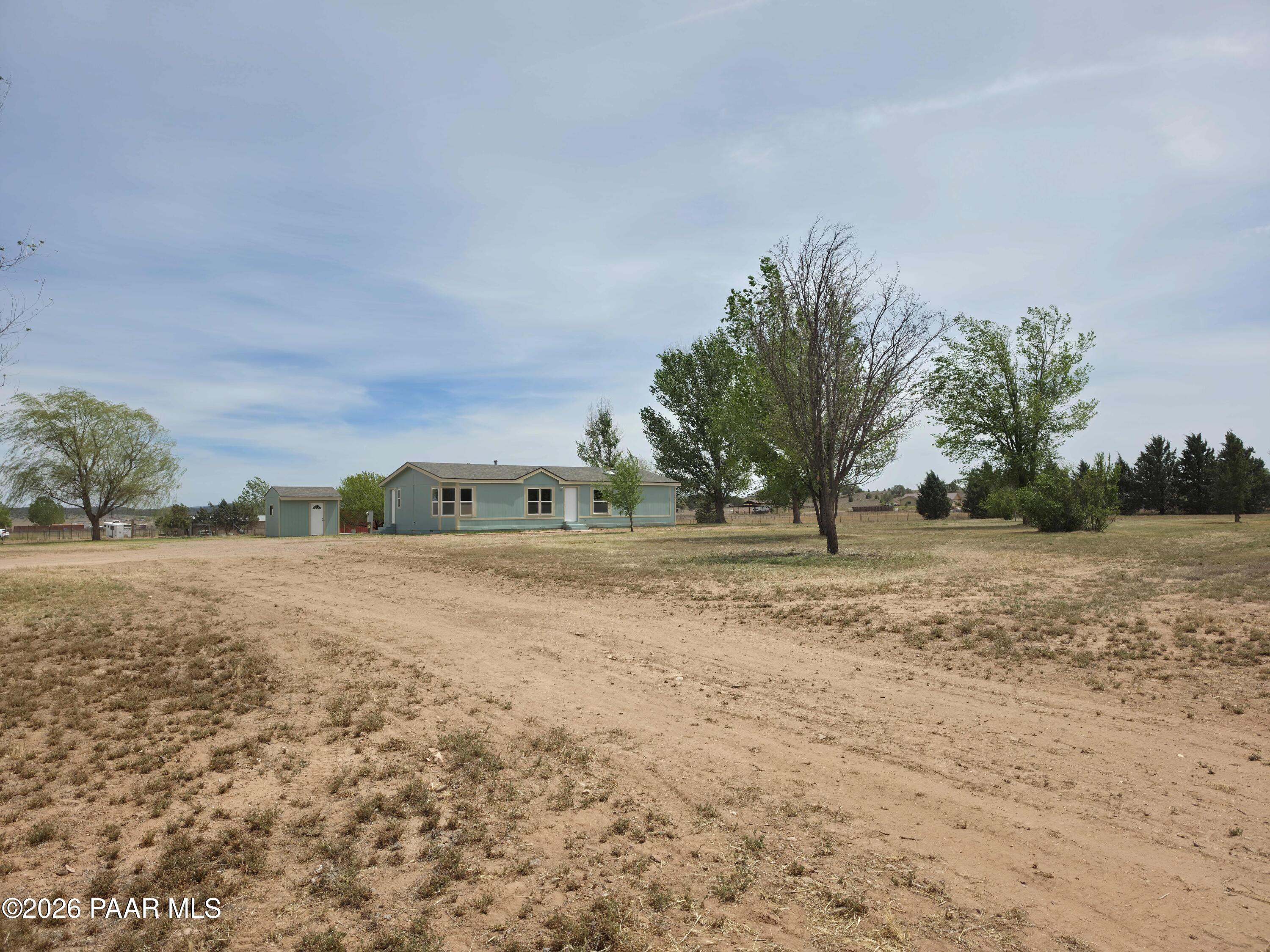 23525 North Ropers Lane Paulden, AZ 86334 - Photo 22 of 25 a view of a field with trees