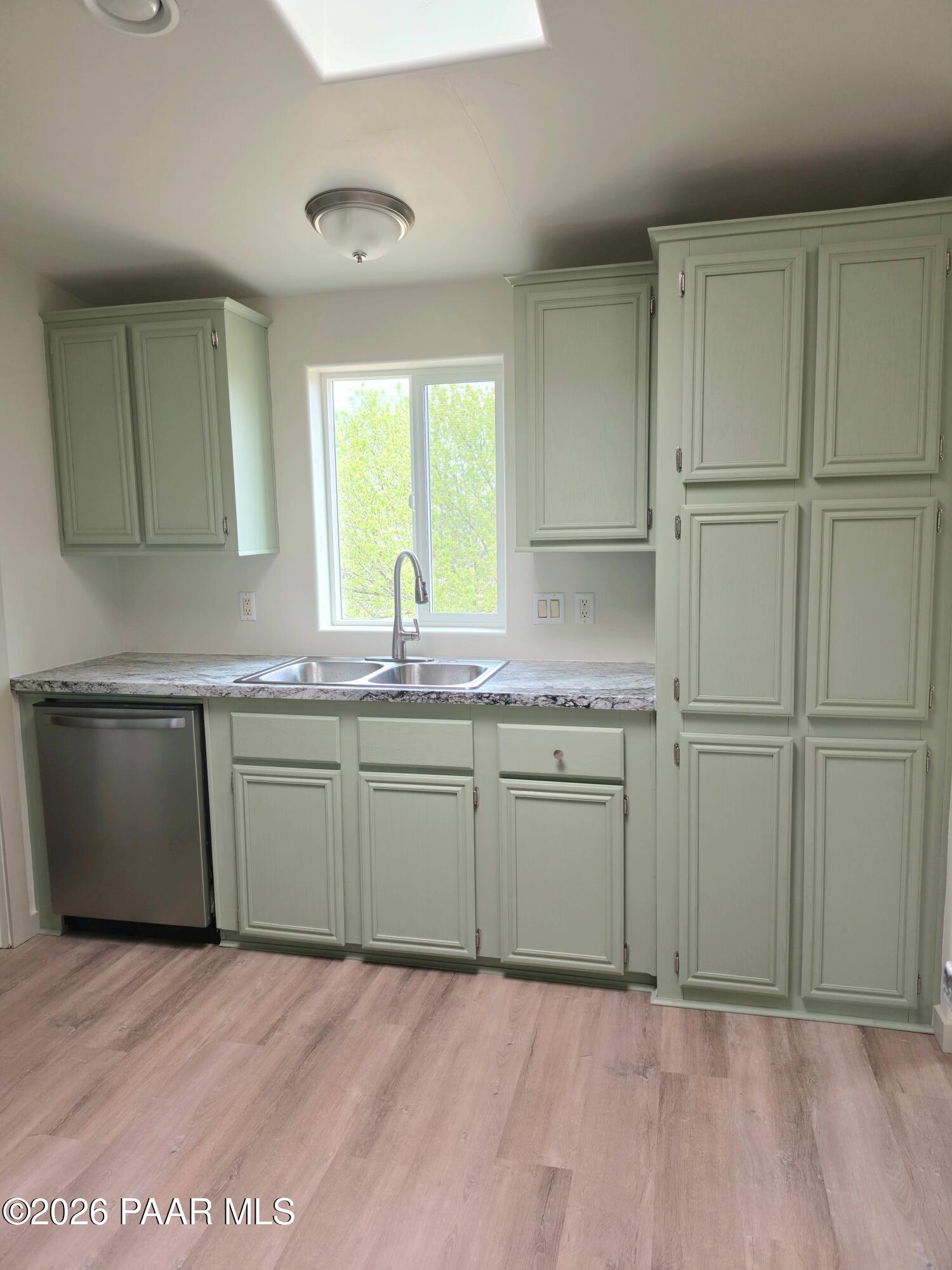 23525 North Ropers Lane Paulden, AZ 86334 - Photo 5 of 25 a kitchen with granite countertop cabinets appliances and a sink
