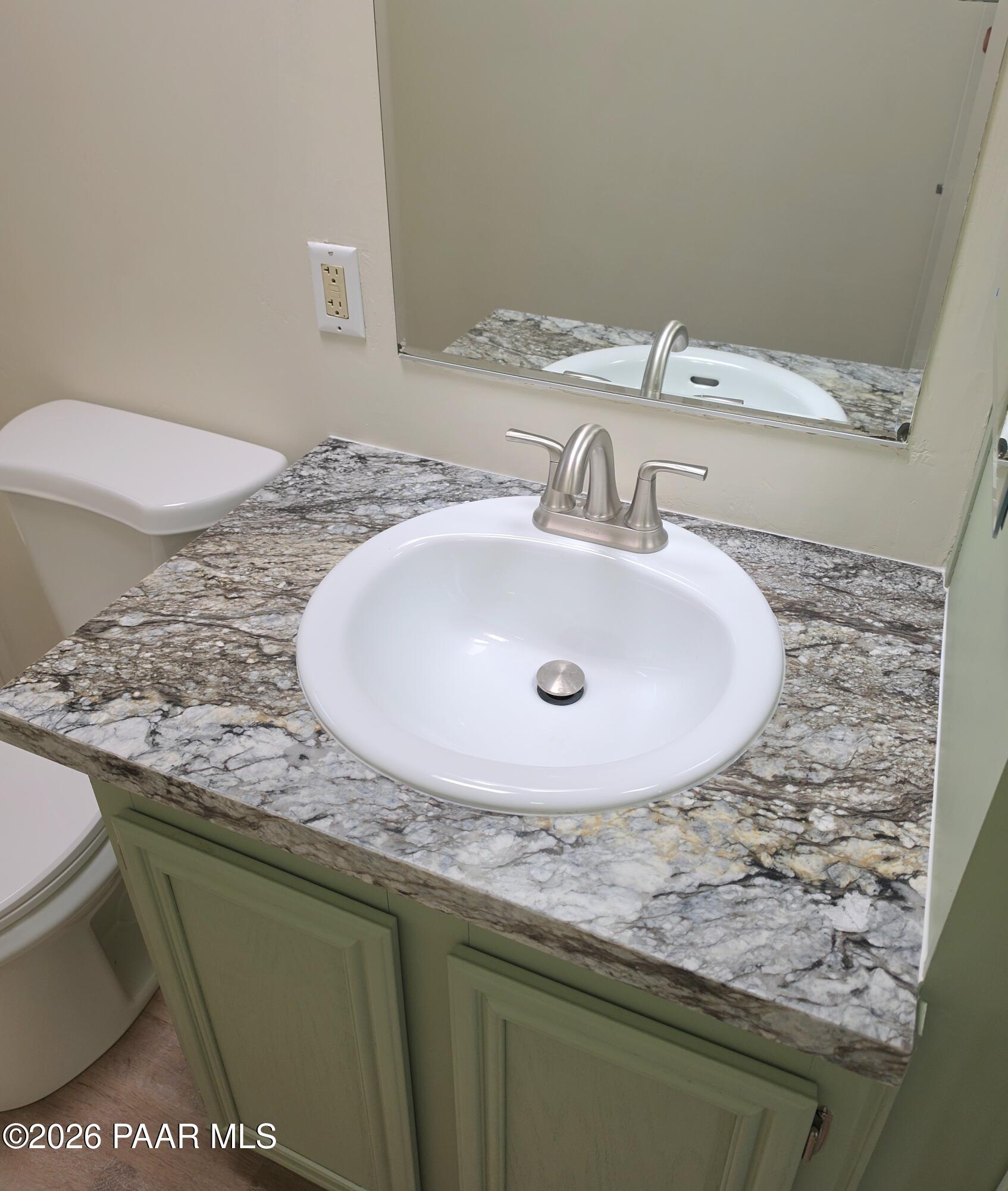 23525 North Ropers Lane Paulden, AZ 86334 - Photo 10 of 25 a bathroom with a granite countertop sink and a toilet