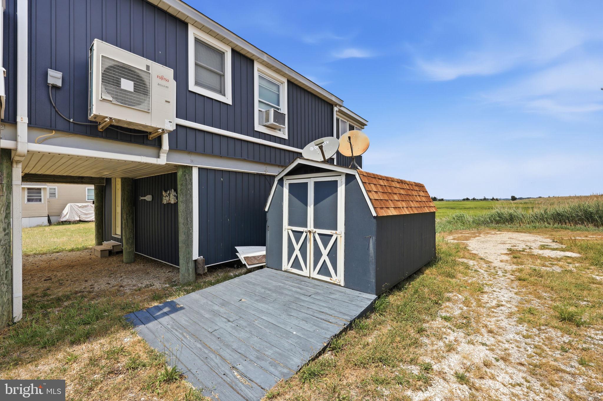 173 Cove Road Newport, NJ 08345 - Photo 38 of 72 a front view of a house with lake