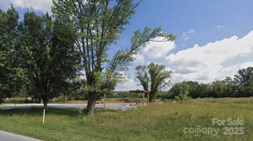 4165 Haywood Road Mills River, NC 28759 - Photo 2 of 4 a view of a lake with a yard