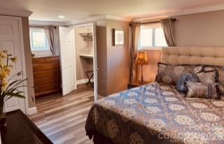 1638 Hughes Gap Road Bakersville, NC 28705 - Photo 11 of 12 a bedroom with a bed and a window