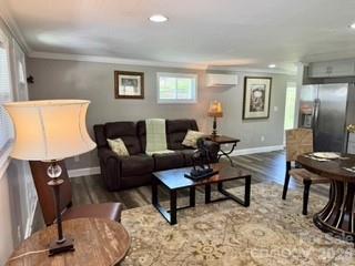 1638 Hughes Gap Road Bakersville, NC 28705 - Photo 5 of 12 a living room with furniture wooden floor and a flat screen tv