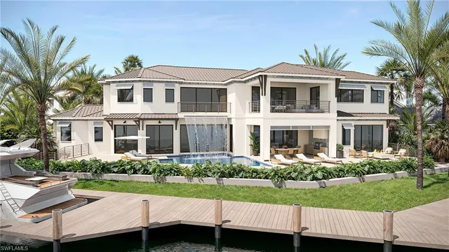 a front view of a house with a yard and potted plants