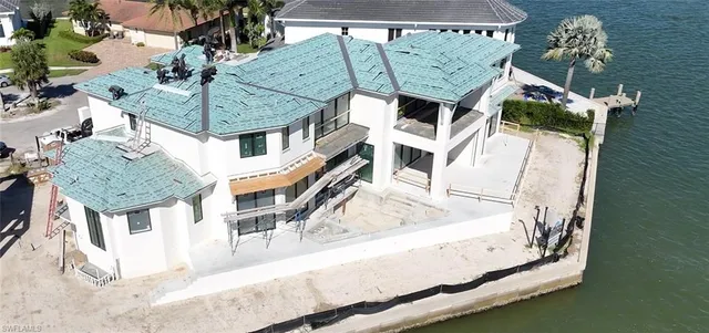 an aerial view of a house with a swimming pool