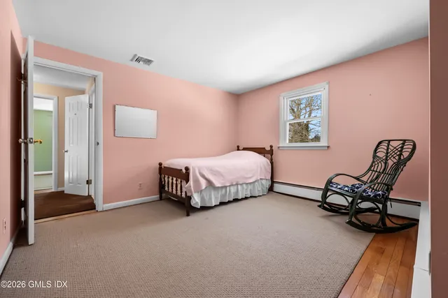 a bedroom with a bed and a table