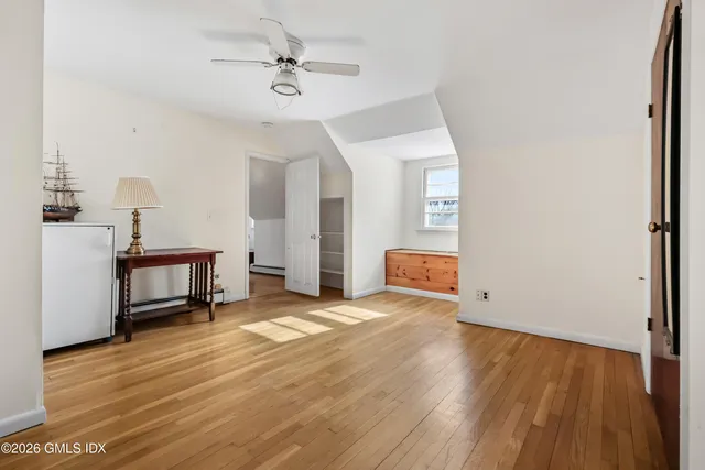 a kitchen with granite countertop a sink stove and refrigerator