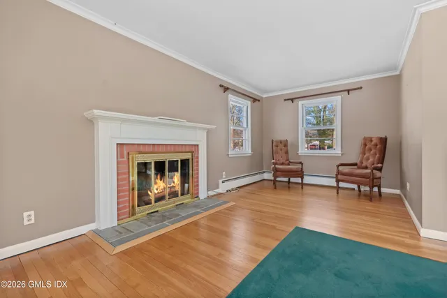 a view of a room with window and wooden floor