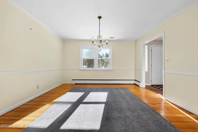 a living room with a bed furniture and a window