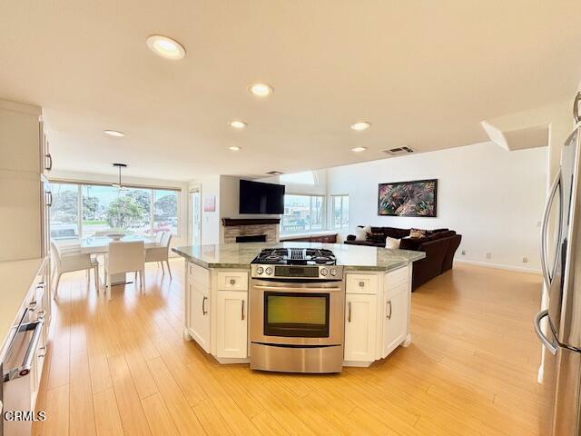3521 Sunset Lane Oxnard, CA 93035 - Photo 20 of 37 a kitchen with a stove a sink and a refrigerator