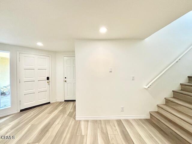 3521 Sunset Lane Oxnard, CA 93035 - Photo 3 of 37 a view of a room with wooden floor and stairs
