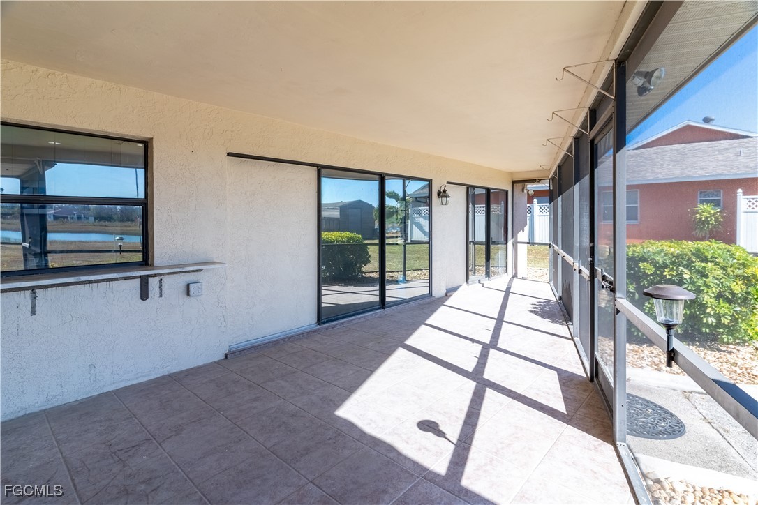 720 Chavers Street East Lehigh Acres, FL 33974 - Photo 15 of 35 a view of balcony and living room