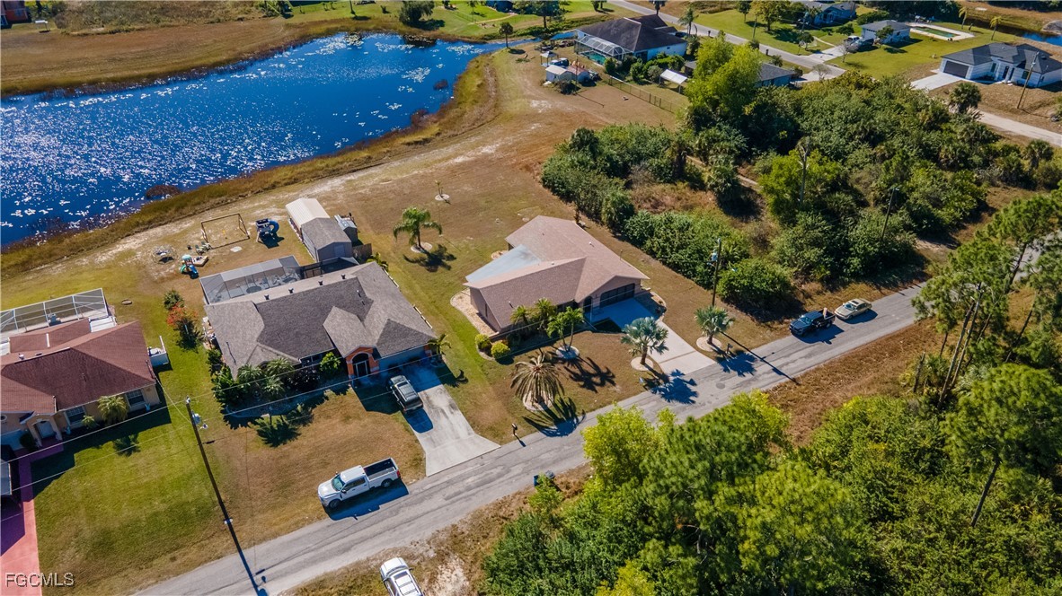 720 Chavers Street East Lehigh Acres, FL 33974 - Photo 30 of 35 an aerial view of house with yard