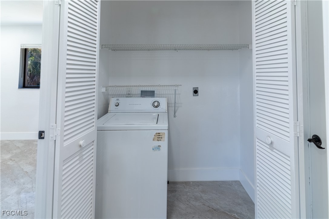 720 Chavers Street East Lehigh Acres, FL 33974 - Photo 33 of 35 a utility room with dryer and washer