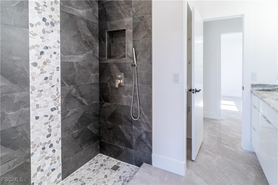 720 Chavers Street East Lehigh Acres, FL 33974 - Photo 8 of 35 a bathroom with a shower