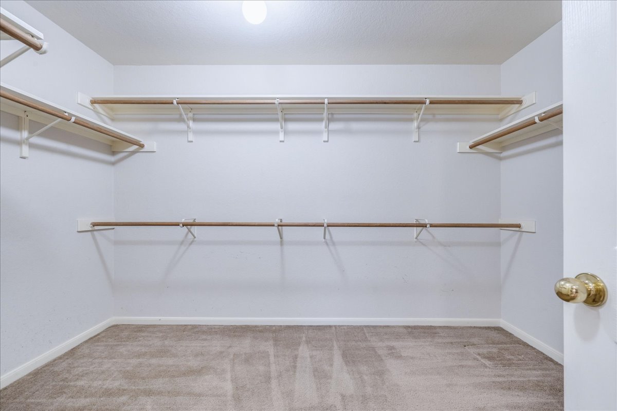 1706 Apache Trail Round Rock, TX 78665 - Photo 21 of 38 The Primary Bedroom walk-in closet is a good size and right off of the Primary Bath.