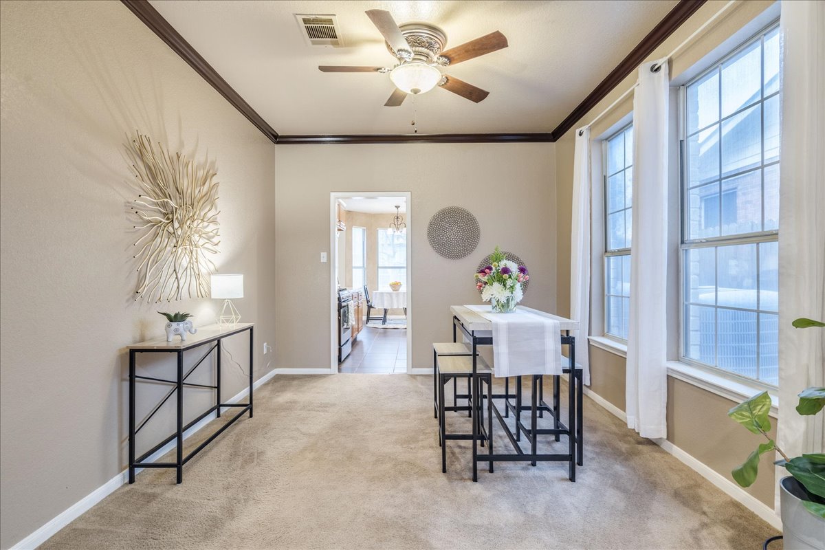 1706 Apache Trail Round Rock, TX 78665 - Photo 6 of 38 The Dining Room is connected to both the Living Room and the Dining Room. The Dining Room also has large windows bringing in natural light.