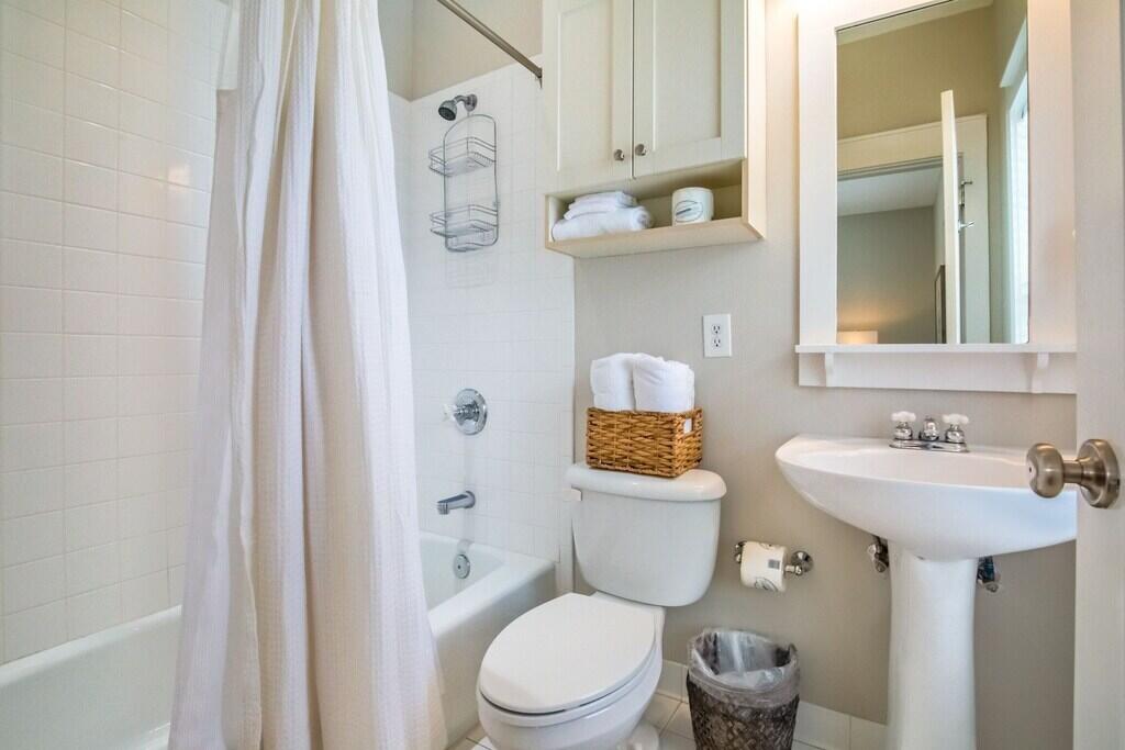 198 Somerset Bridge Road, Unit 141 Santa Rosa Beach, FL 32459 - Photo 22 of 31 a bathroom with a toilet sink and mirror