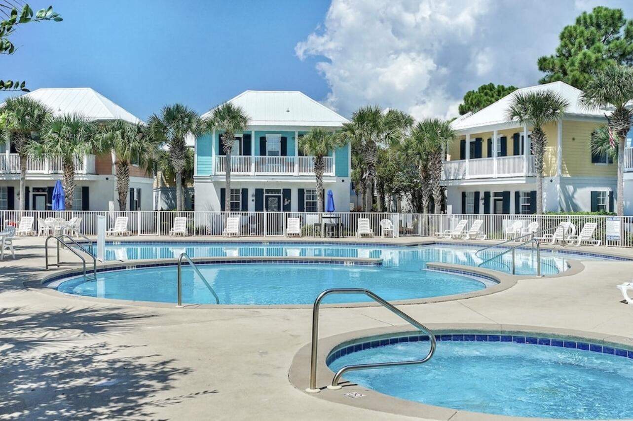 198 Somerset Bridge Road, Unit 141 Santa Rosa Beach, FL 32459 - Photo 24 of 31 a swimming pool with outdoor seating and yard