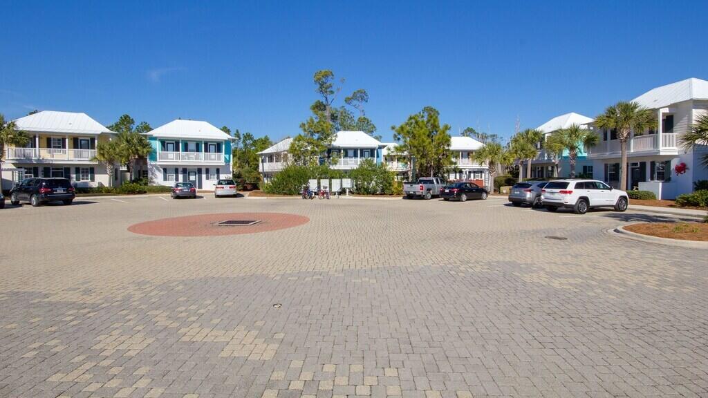 198 Somerset Bridge Road, Unit 141 Santa Rosa Beach, FL 32459 - Photo 26 of 31 a group of cars parked in front of building