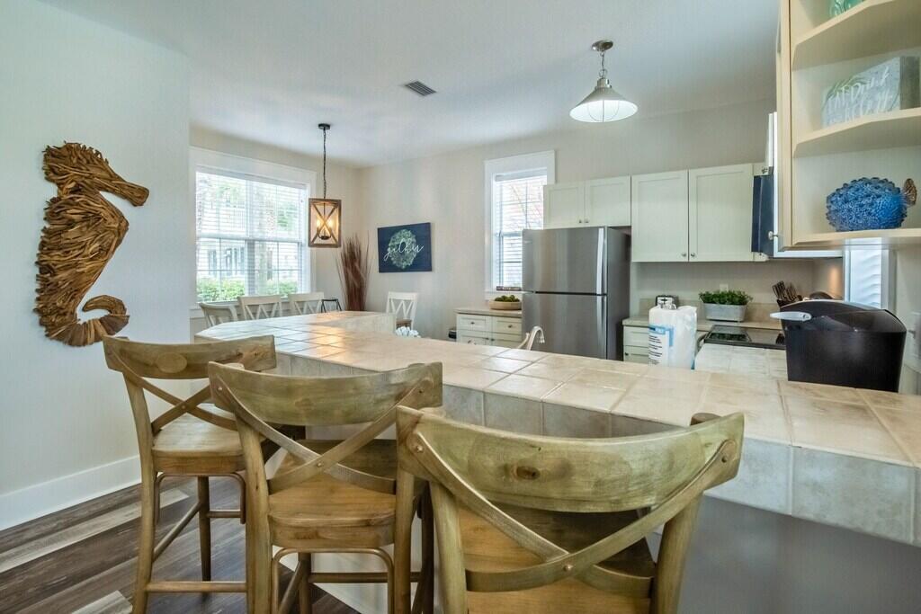 198 Somerset Bridge Road, Unit 141 Santa Rosa Beach, FL 32459 - Photo 8 of 31 a dining room with furniture and window