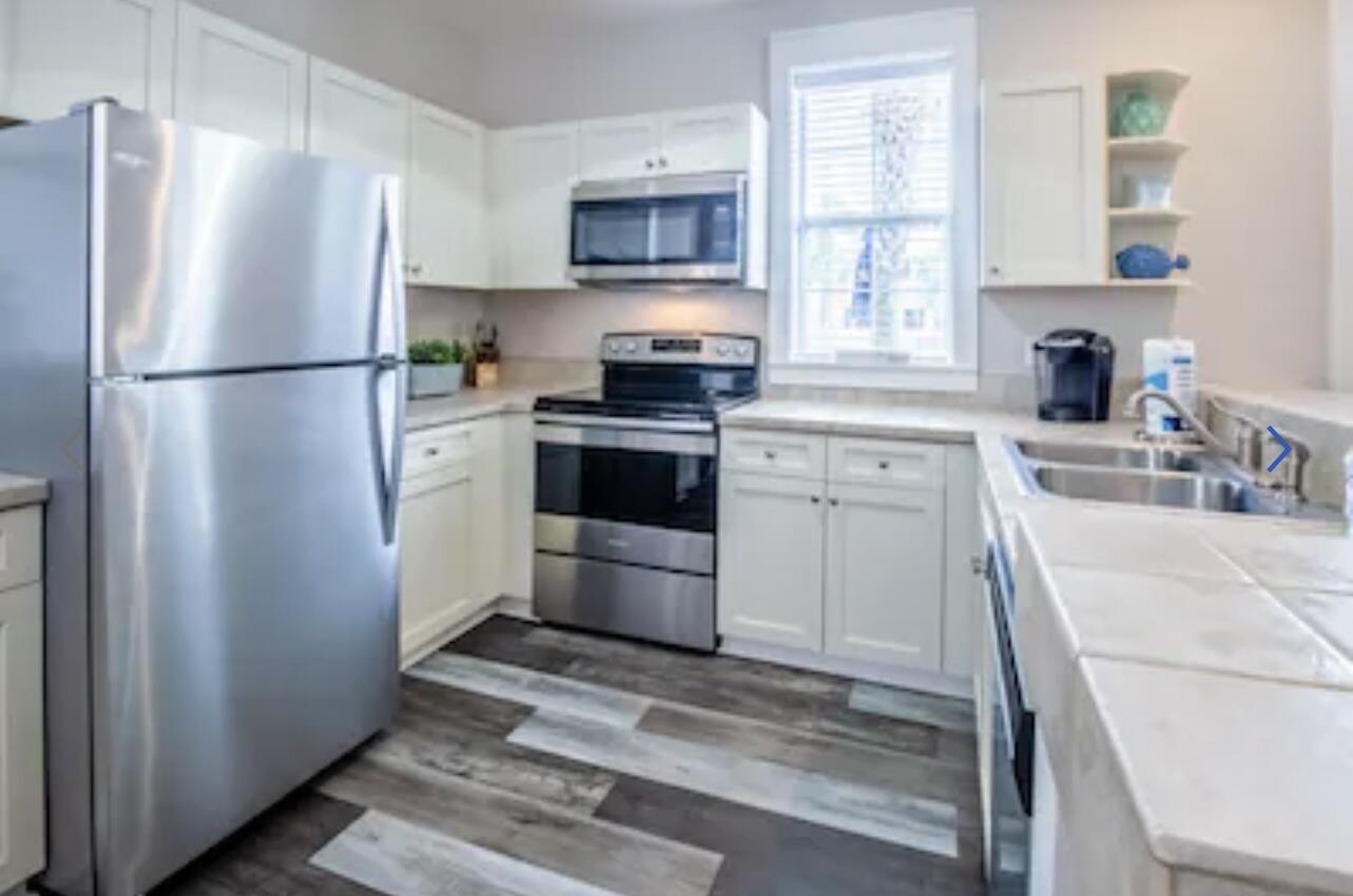 198 Somerset Bridge Road, Unit 141 Santa Rosa Beach, FL 32459 - Photo 10 of 31 a kitchen with a refrigerator stove and sink