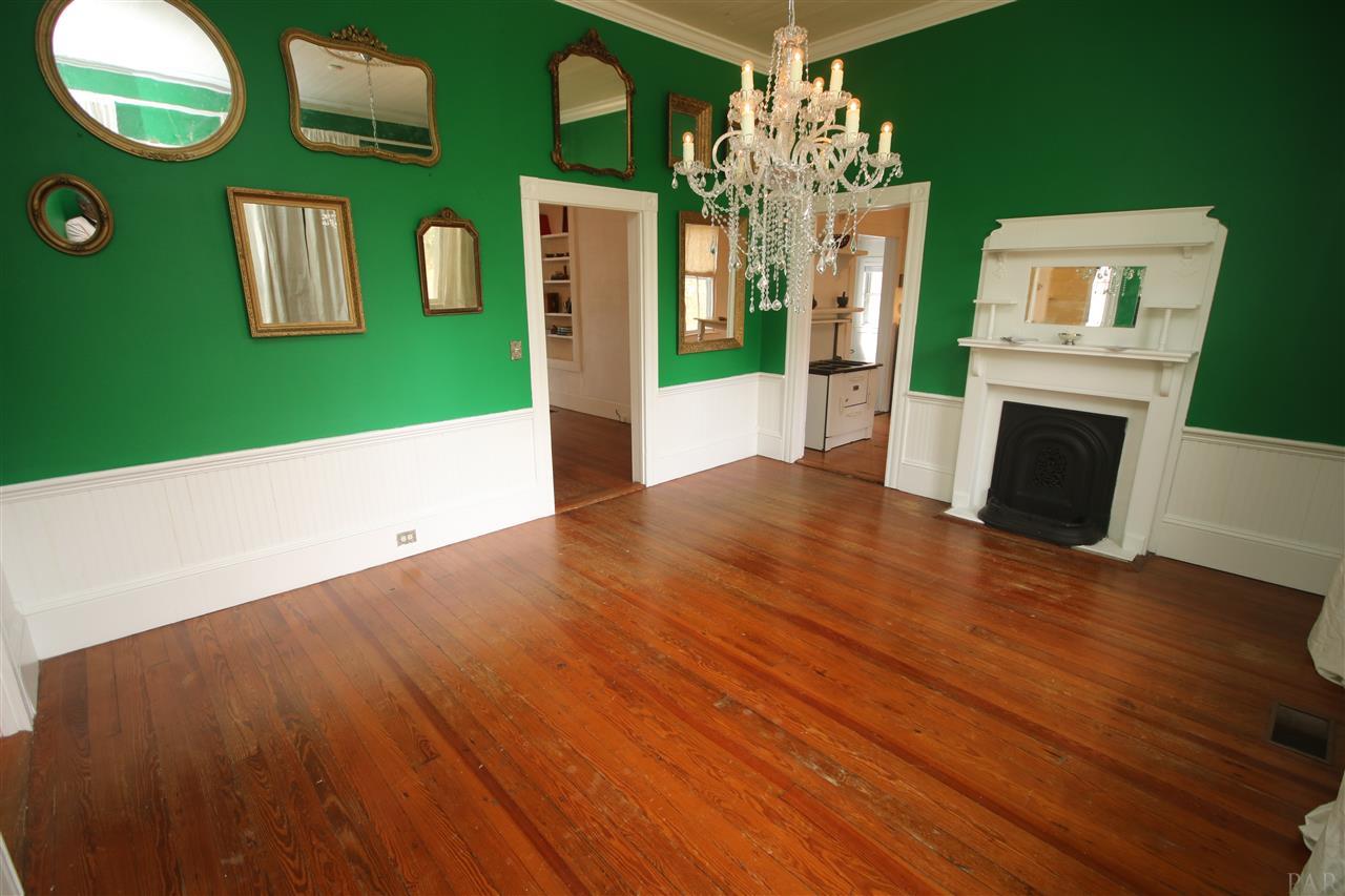 6810 Berryhill Road Milton, FL 32570 - Photo 15 of 50 mantle. Beautiful custom paint & Heart Pine floor.