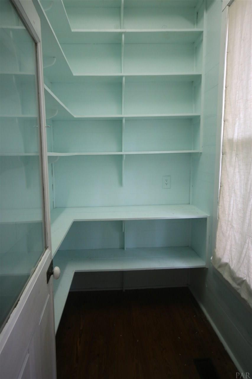 6810 Berryhill Road Milton, FL 32570 - Photo 21 of 50 w/large window, tons of shelving & 1/2 glass door.
