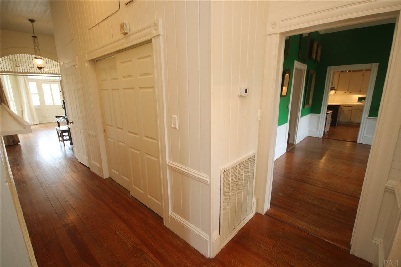 6810 Berryhill Road Milton, FL 32570 - Photo 24 of 50 the parlor & dining room. 2 closets in hallway.
