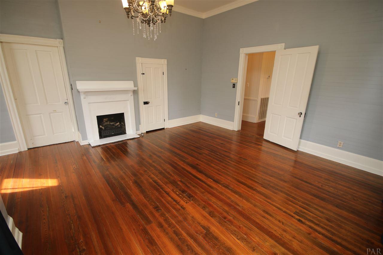 6810 Berryhill Road Milton, FL 32570 - Photo 27 of 50 mantle. Closet to the right of fireplace.