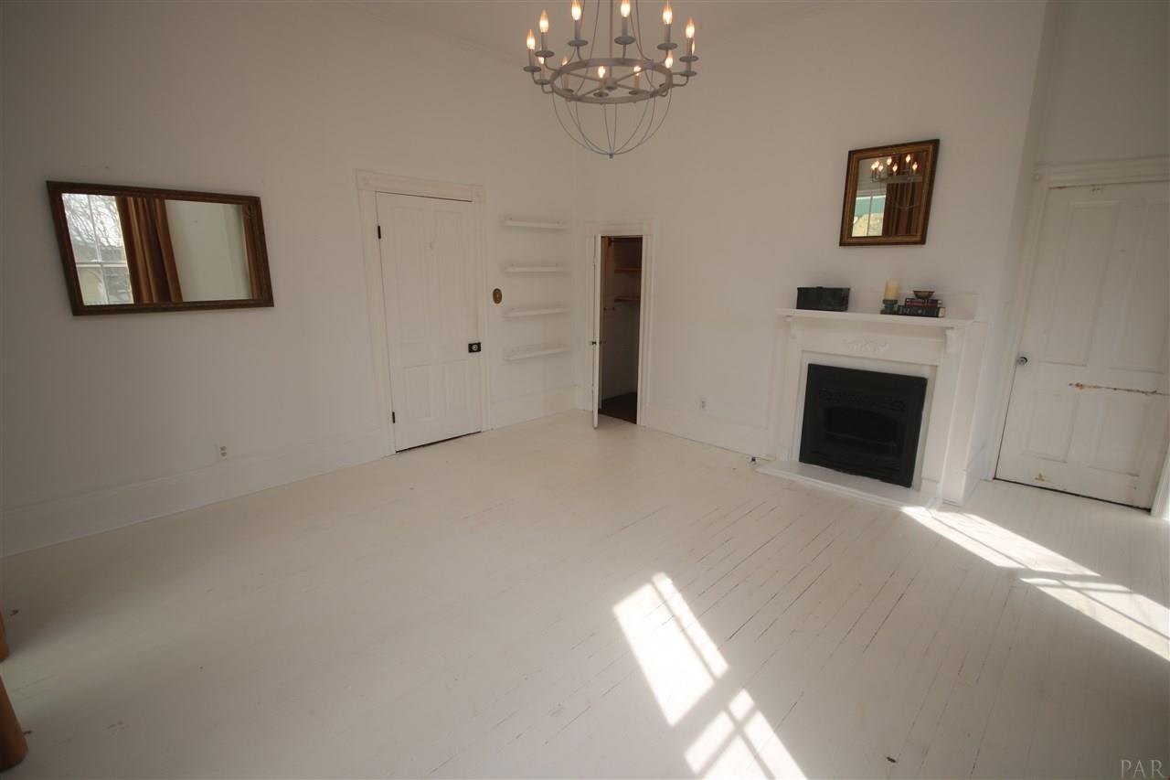 6810 Berryhill Road Milton, FL 32570 - Photo 36 of 50 mantel. Closet to the left of fireplace.