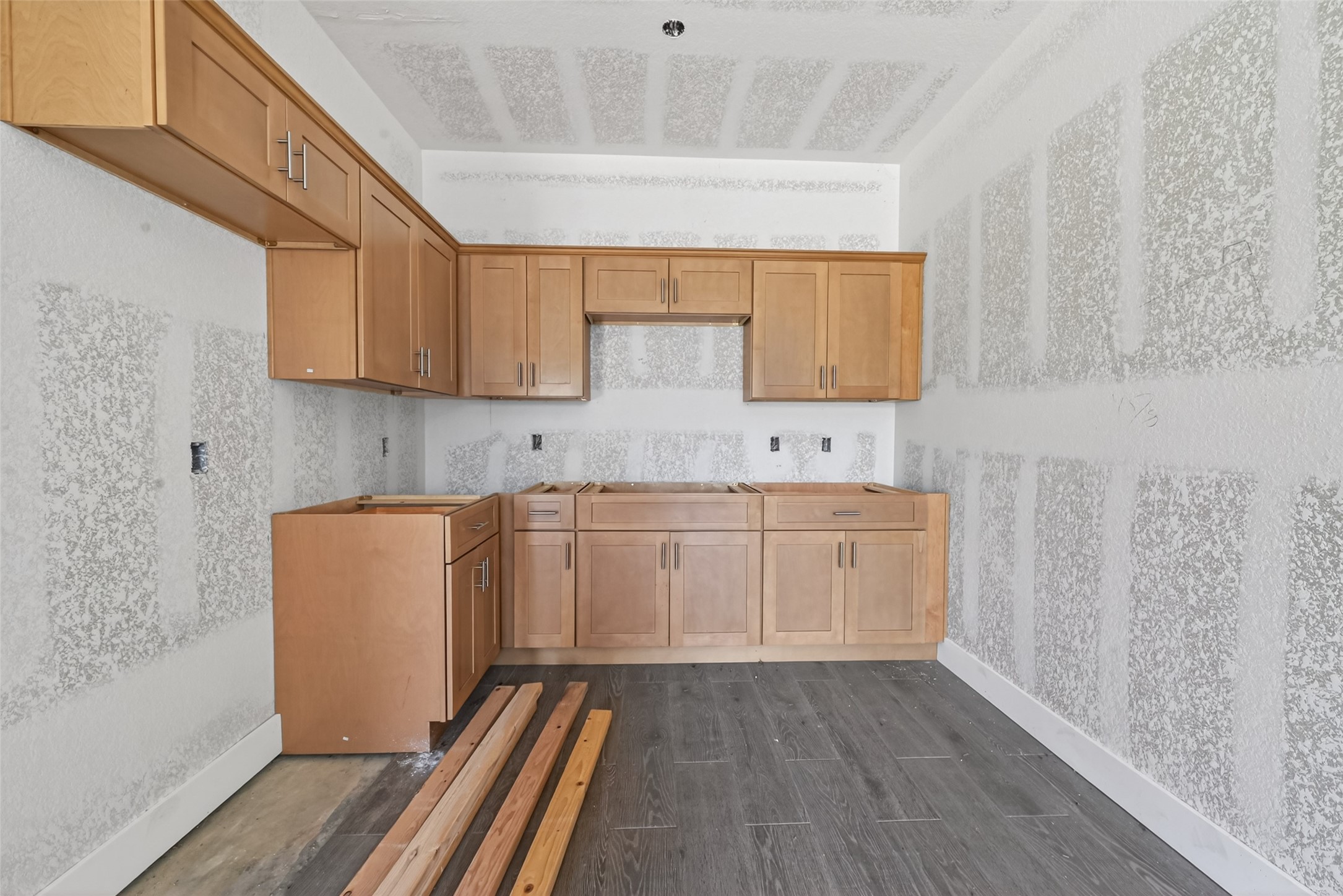 8023 Pool Hill Road Fulshear, TX 77441 - Photo 29 of 50 a room with wooden cabinets and a sink