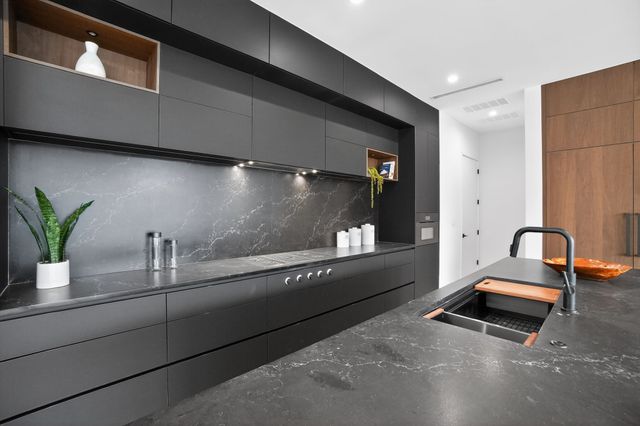 a bedroom with a large bed and a large window