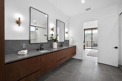 a bathroom with a bathtub and shower