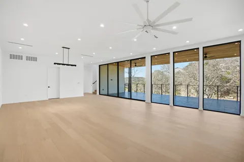 a view of outdoor space with wooden floor and city view