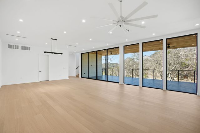 a bathroom with a sink toilet a mirror and shower