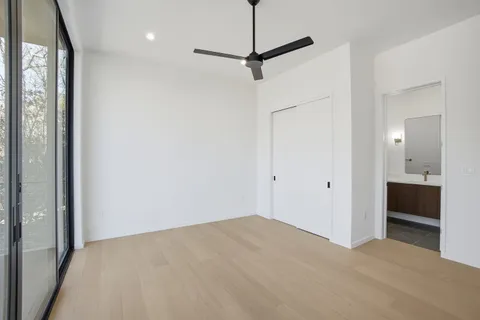 a bathroom with a sink toilet a mirror and shower
